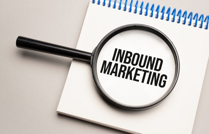 magnifying-glass-with-word-inbound-marketing-chart-background