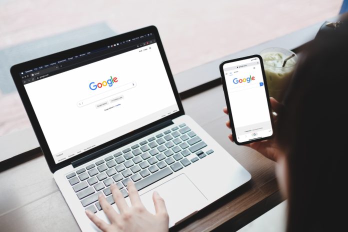 woman-is-typing-google-search-engine-from-laptop-cell-phone-google-is-biggest-internet-search-engine-world